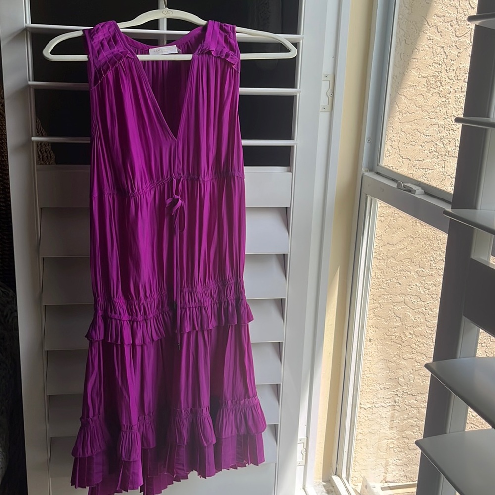She is a size small and from the brand ramybrook company! Eye catching purple!